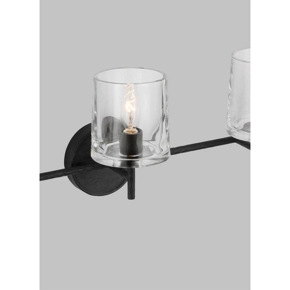 Marietta 24 in. 3-Light Aged Iron Bathroom Vanity Light with Clear Glass Shades by Generation Lighting Designer Collections 6 Marietta 24 in. 3-Light Aged Iron Bathroom Vanity Light with Clear Glass Shades by Generation Lighting Designer Collections - Image 4